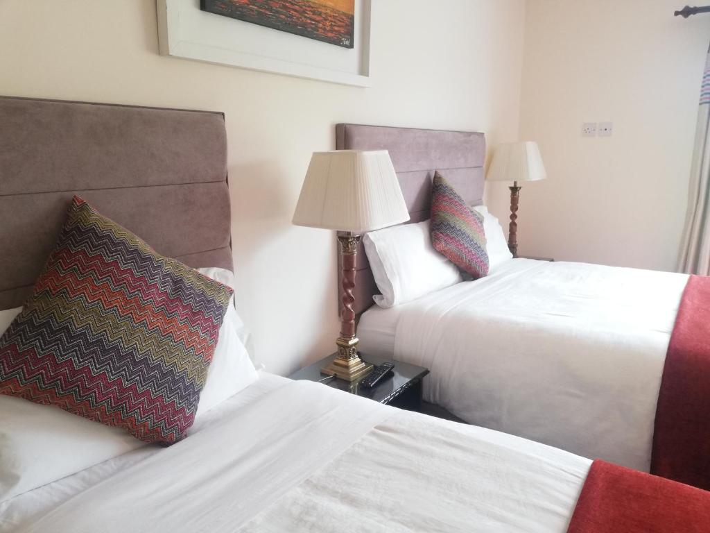 Postel nebo postele na pokoji v ubytování O'Sheas Ceol Na Habhann B&B