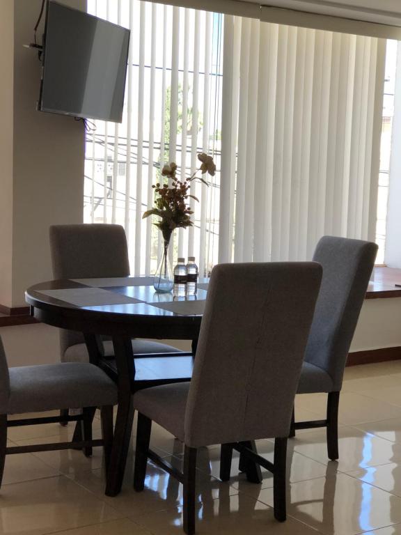 TV a/nebo společenská místnost v ubytování Departamentos Bonsai