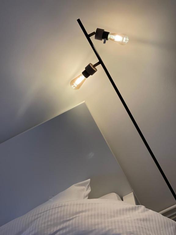Postel nebo postele na pokoji v ubytování NEOZONE Appart-Hotel Malmedy
