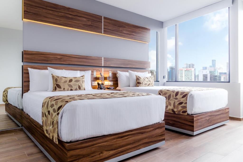 Postel nebo postele na pokoji v ubytování Sleep Inn Ciudad de Mexico Cuajimalpa