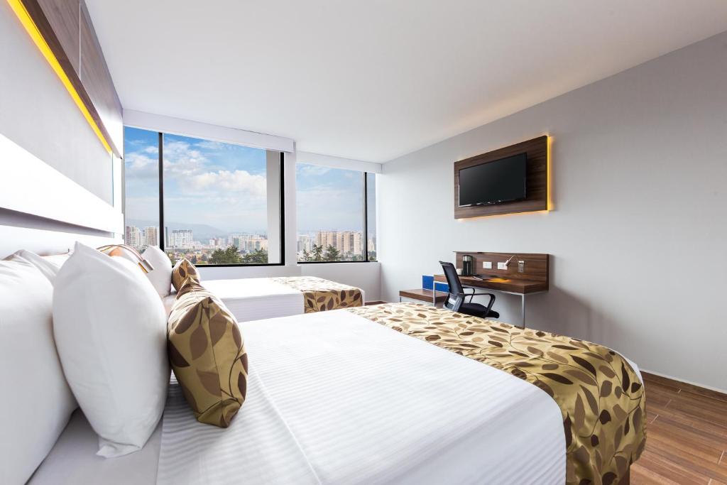 TV a/nebo společenská místnost v ubytování Sleep Inn Ciudad de Mexico Cuajimalpa