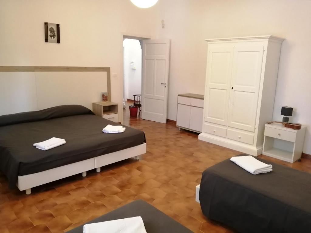 Łóżko lub łóżka w pokoju w obiekcie Villa Graziella