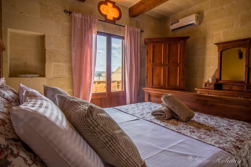 Postel nebo postele na pokoji v ubytování Mandolina Casa