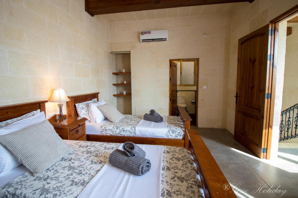 Postel nebo postele na pokoji v ubytování Mandolina Casa