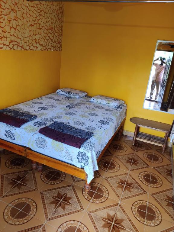 Letto o letti in una camera di Archana Guest House River View