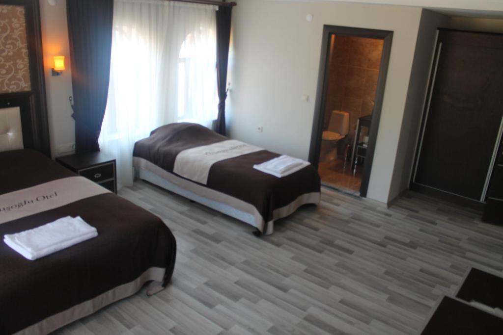 Postel nebo postele na pokoji v ubytování Oz Cavusoglu Hotel