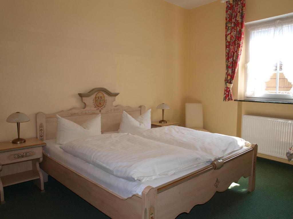 Postel nebo postele na pokoji v ubytování Hotel Gasthof Schuster und Gästehaus