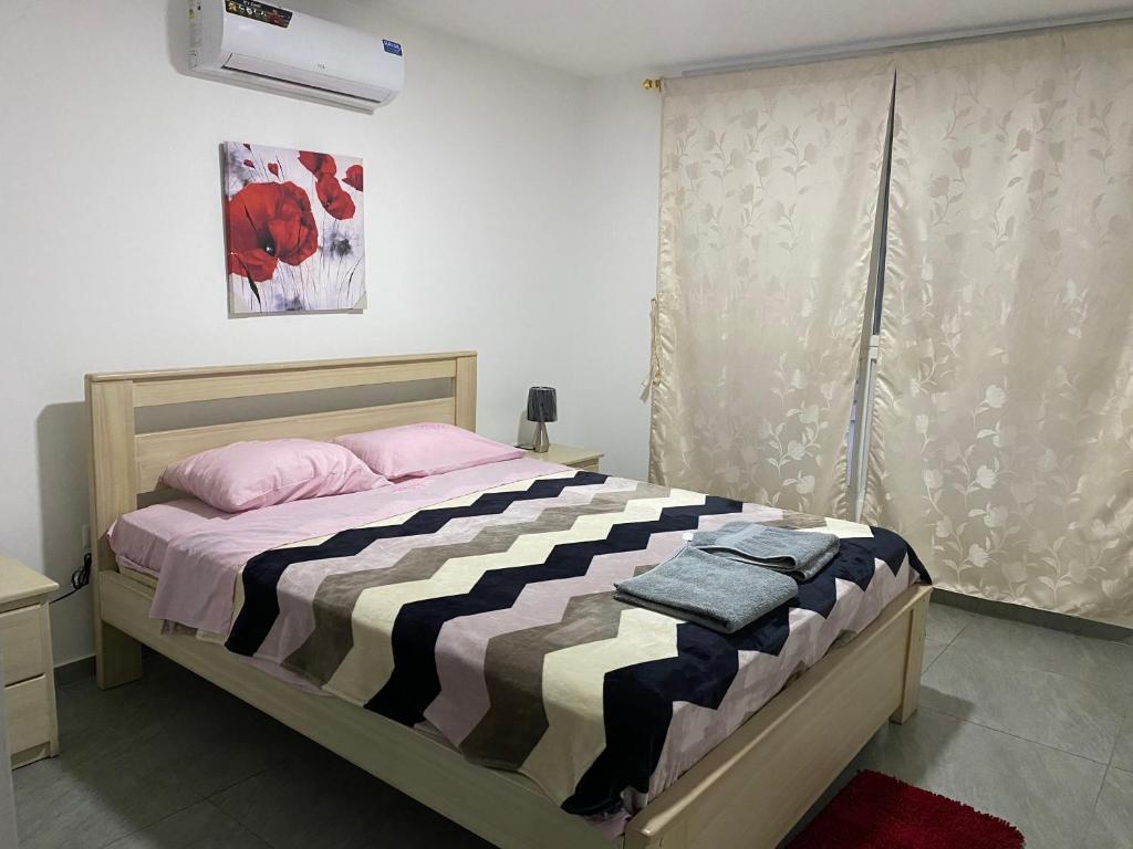 Кровать или кровати в номере KattyApartament1102