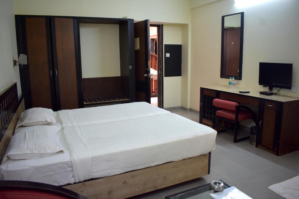 Postel nebo postele na pokoji v ubytování Hotel Metropolis