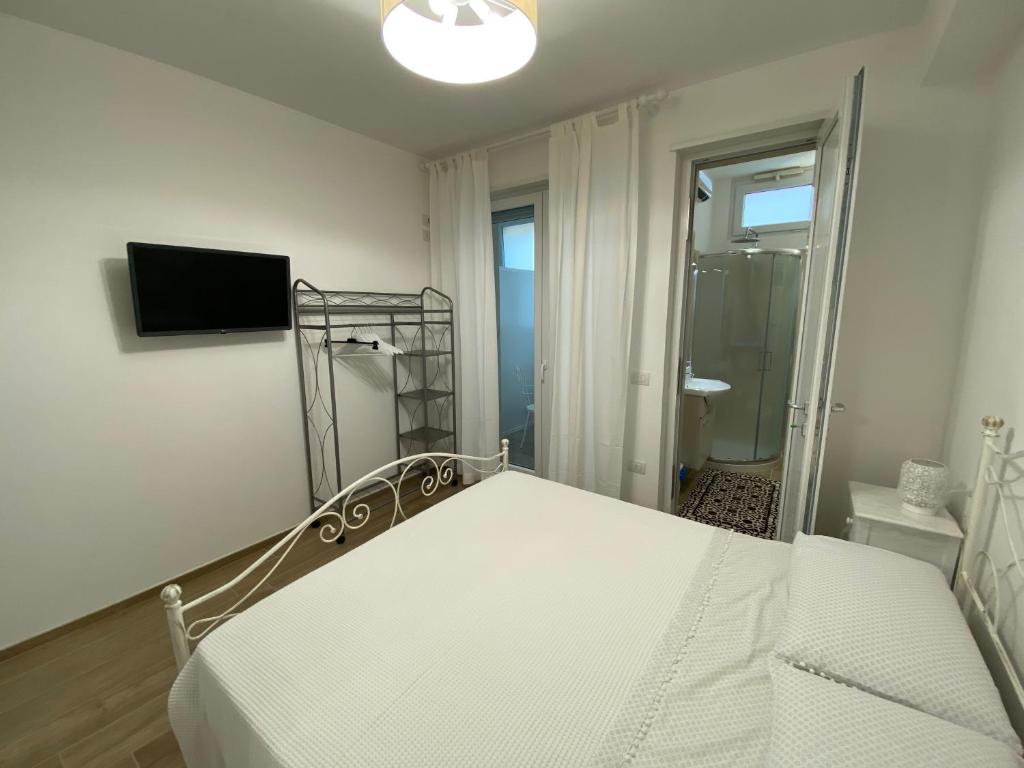 Postel nebo postele na pokoji v ubytování Amare il Mare