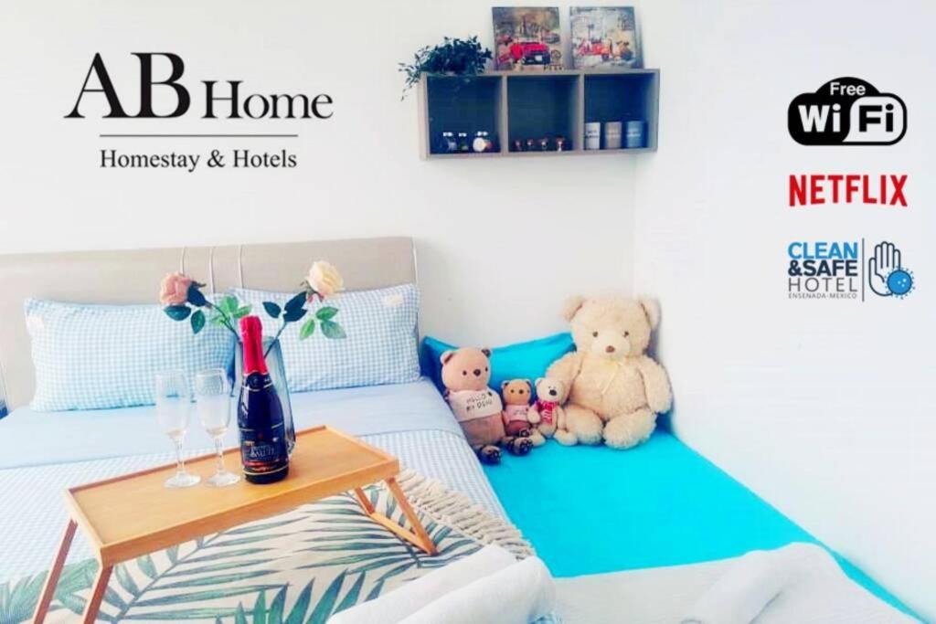 a room with a bed with teddy bears and a table at ABHome "BROWNIE SUITE" #NO USE in Masai