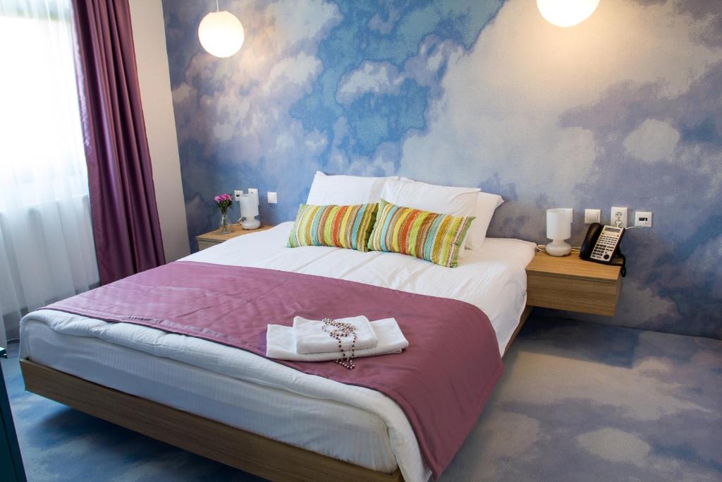 Postel nebo postele na pokoji v ubytování Aparthotel Gutinului