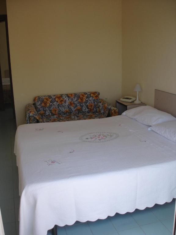 Postel nebo postele na pokoji v ubytování Hotel La Rusticana