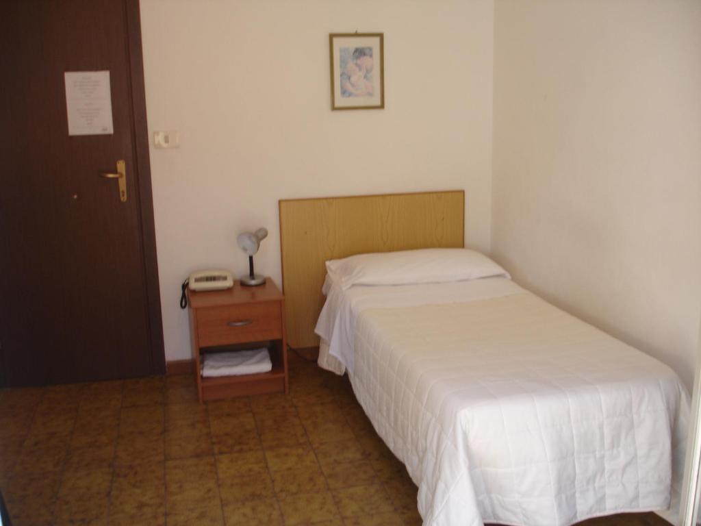 Postel nebo postele na pokoji v ubytování Hotel La Rusticana