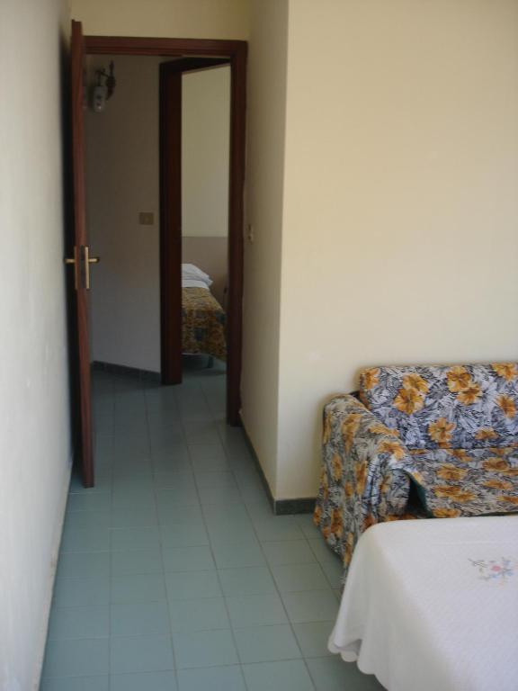 Postel nebo postele na pokoji v ubytování Hotel La Rusticana