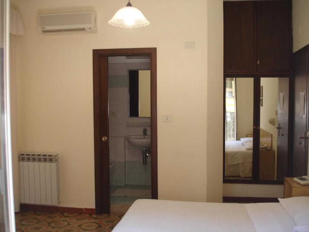 Postel nebo postele na pokoji v ubytování Hotel La Rusticana