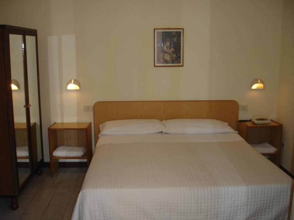 Postel nebo postele na pokoji v ubytování Hotel La Rusticana
