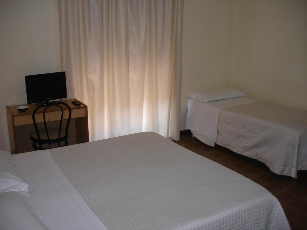 Postel nebo postele na pokoji v ubytování Hotel La Rusticana