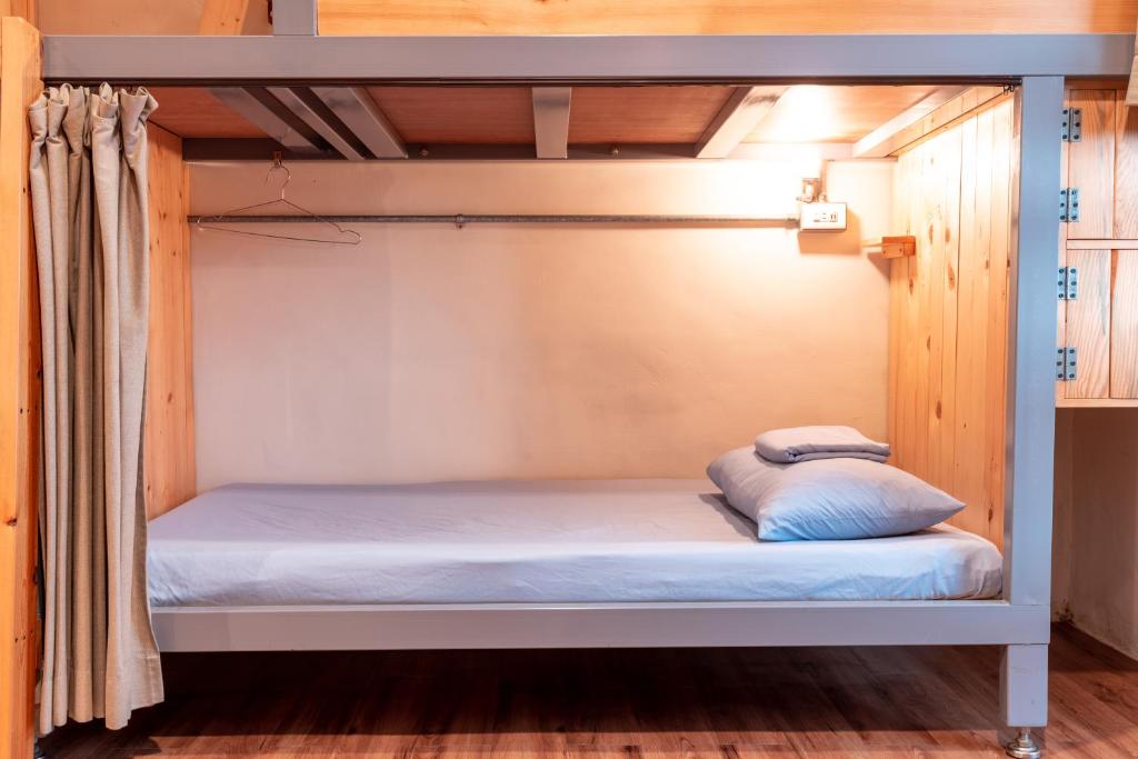 Postel nebo postele na pokoji v ubytování Yilan Inspiration