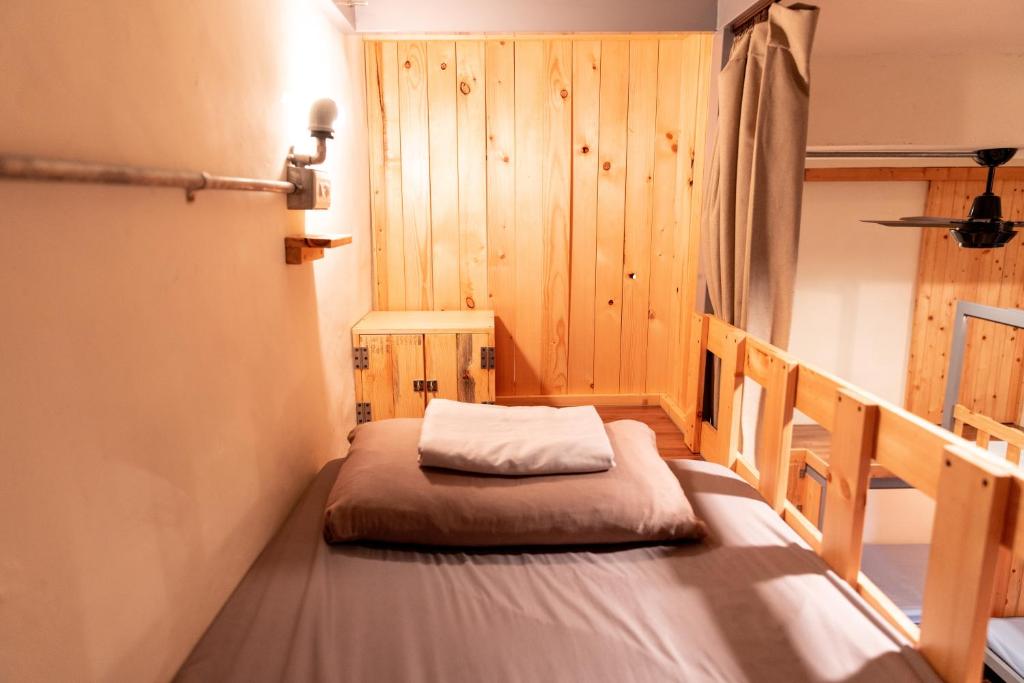 Postel nebo postele na pokoji v ubytování Yilan Inspiration
