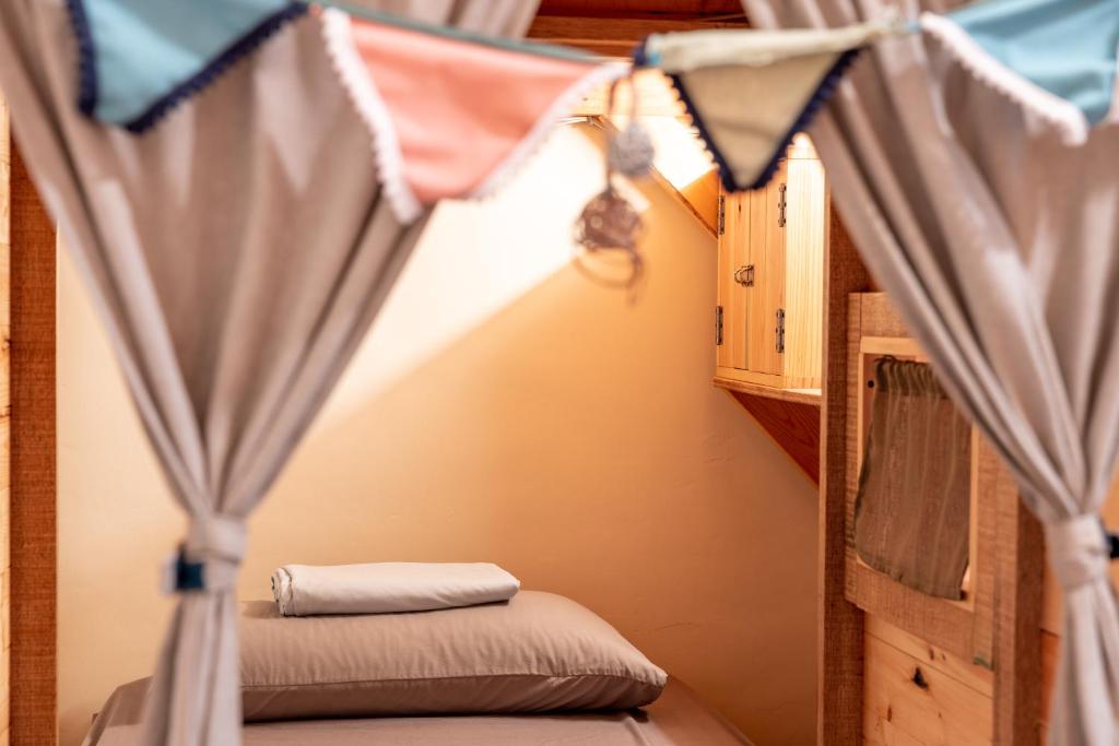 Postel nebo postele na pokoji v ubytování Yilan Inspiration