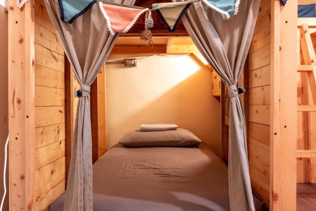 Postel nebo postele na pokoji v ubytování Yilan Inspiration