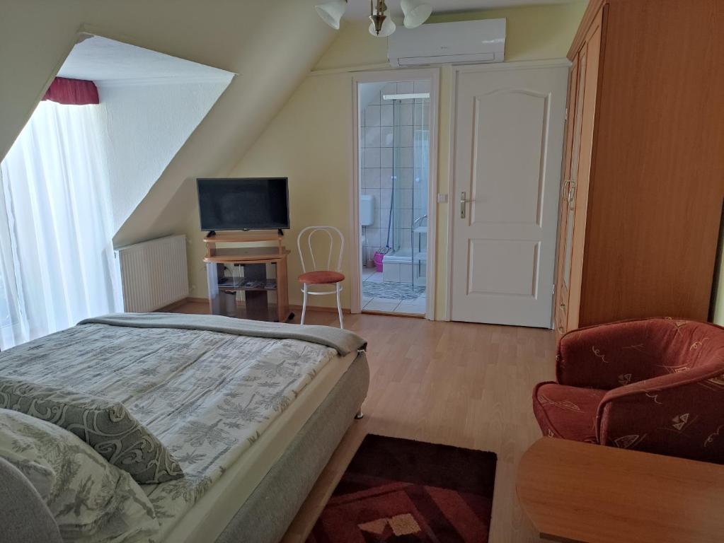 Postel nebo postele na pokoji v ubytování Zsanett Appartement