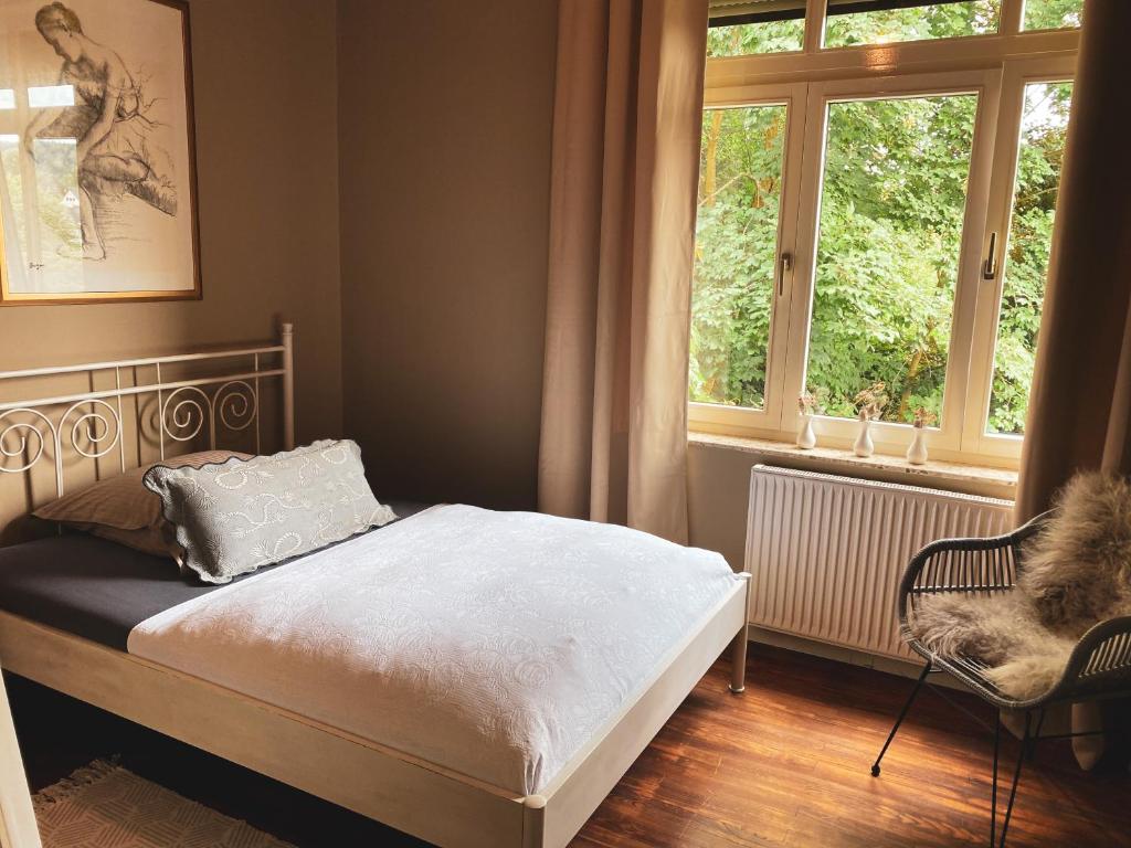 Postel nebo postele na pokoji v ubytování Ring Residenz in Adenau direkt am Nürburgring
