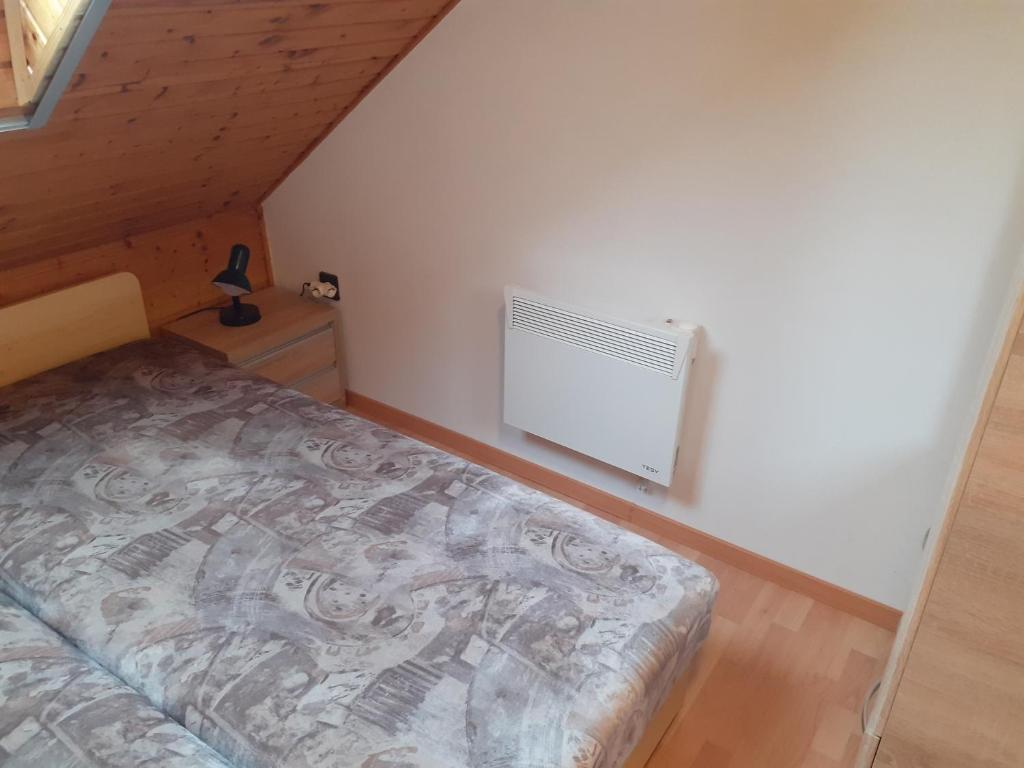 Posteľ alebo postele v izbe v ubytovaní Pátri Apartmanház
