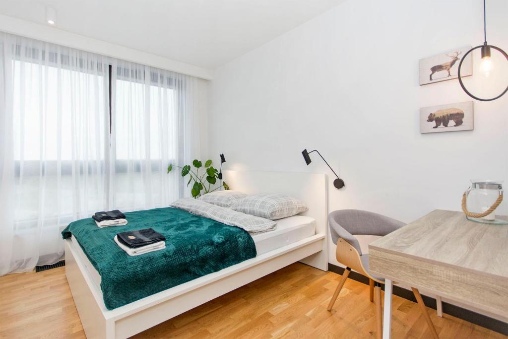 Postel nebo postele na pokoji v ubytování Apartament Rodzinny Portova