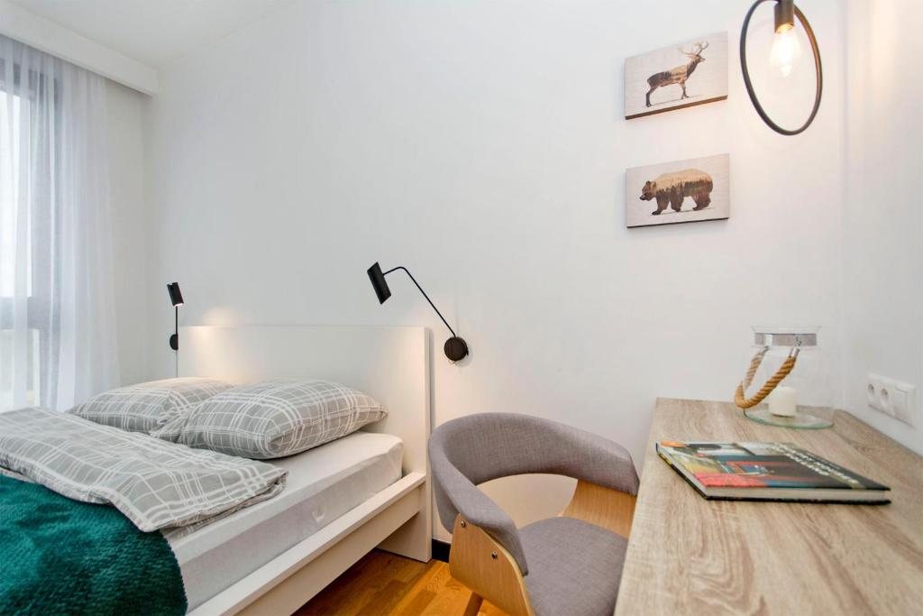 Postel nebo postele na pokoji v ubytování Apartament Rodzinny Portova