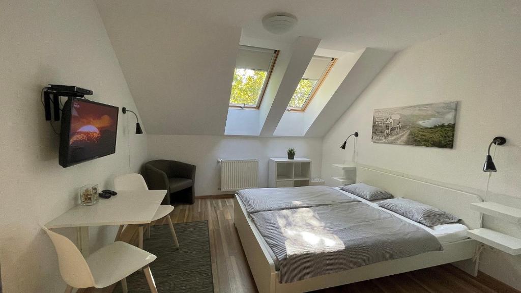 Posteľ alebo postele v izbe v ubytovaní Benevia Apartments
