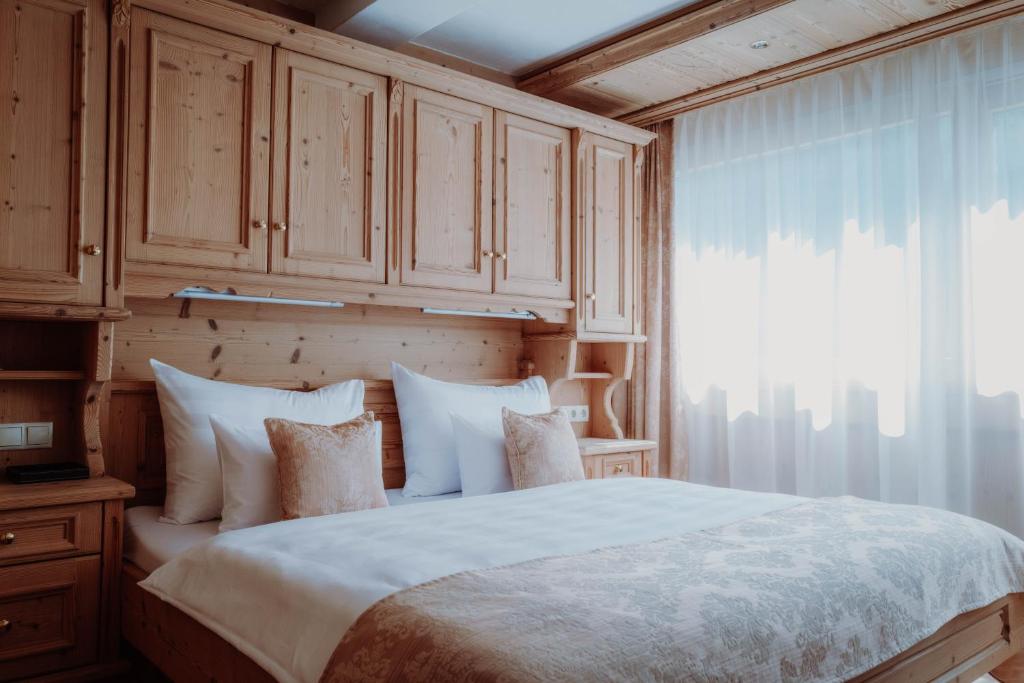 Postel nebo postele na pokoji v ubytování Das Verwall - finest serviced apartments