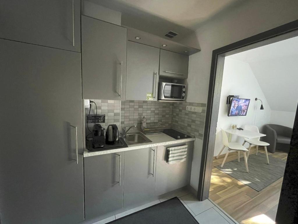 Kuchyňa alebo kuchynka v ubytovaní Benevia Apartments