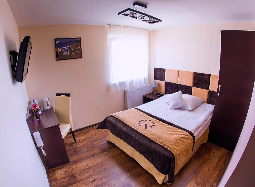 Postel nebo postele na pokoji v ubytování Boutique Hotel's III Piłsudskiego