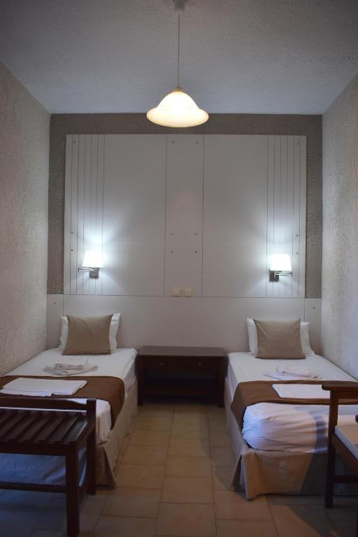 Postel nebo postele na pokoji v ubytování Altis Hotel