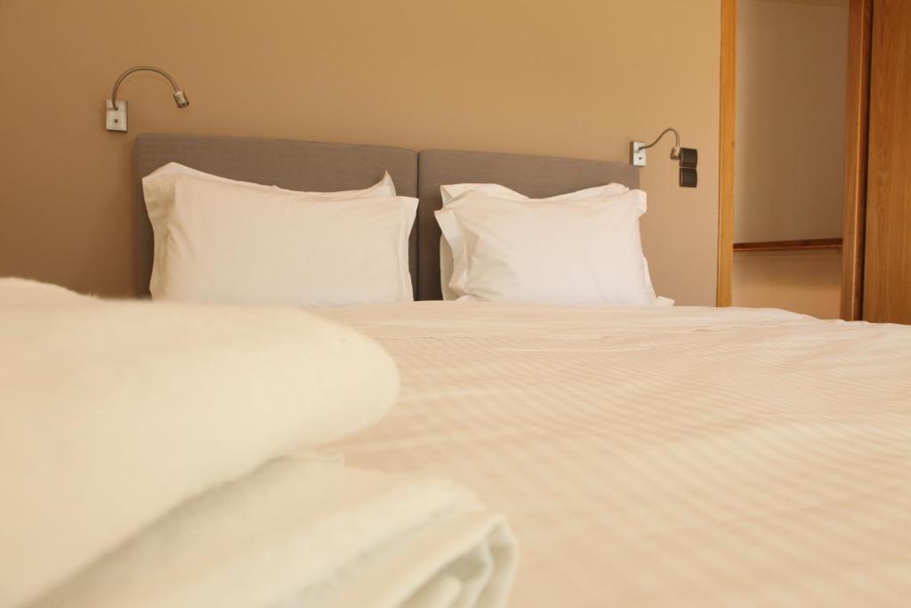 Posteľ alebo postele v izbe v ubytovaní Horizonte Seafront Suites