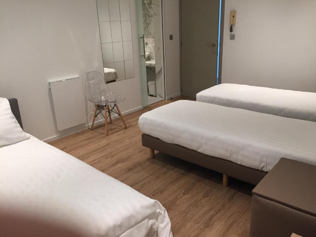 Voodi või voodid majutusasutuse Shelter-rooms toas