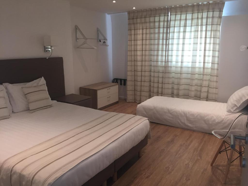 Voodi või voodid majutusasutuse Shelter-rooms toas