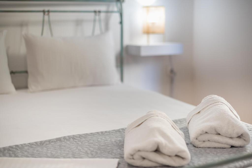 A bed or beds in a room at Athens Bright Suite by CloudKeys