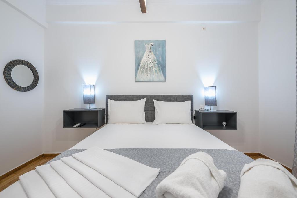 A bed or beds in a room at Athens Bright Suite by CloudKeys