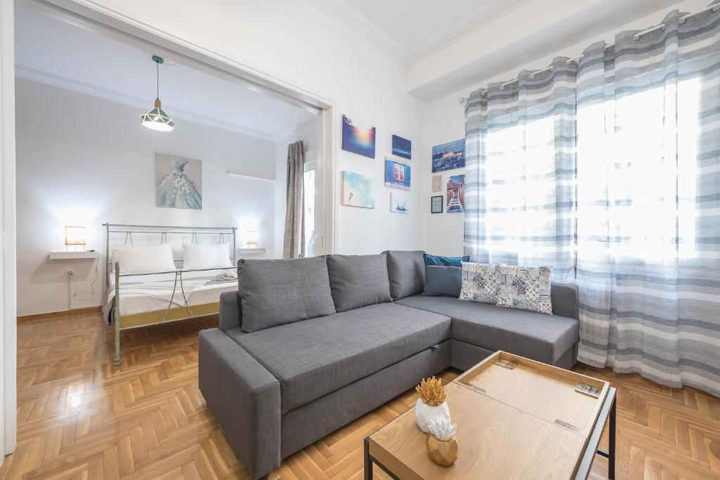 A seating area at Athens Bright Suite by CloudKeys