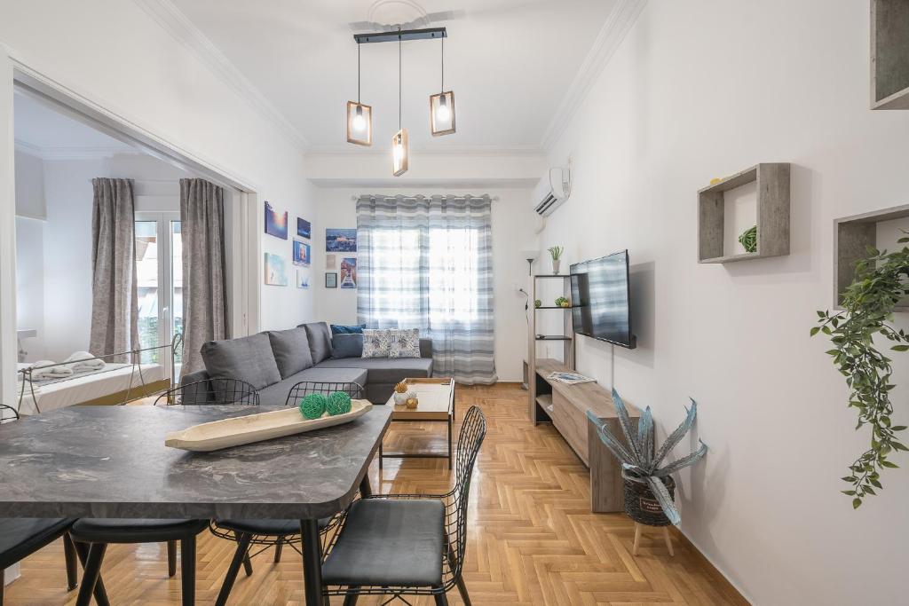 A seating area at Athens Bright Suite by CloudKeys
