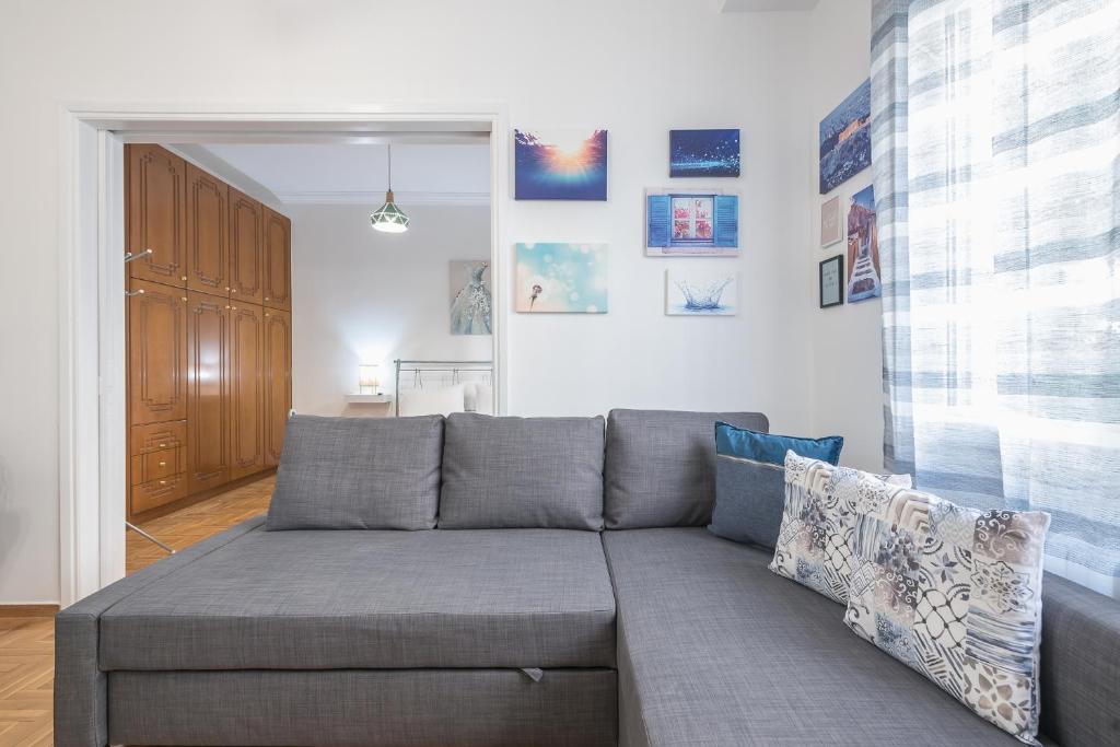 A seating area at Athens Bright Suite by CloudKeys