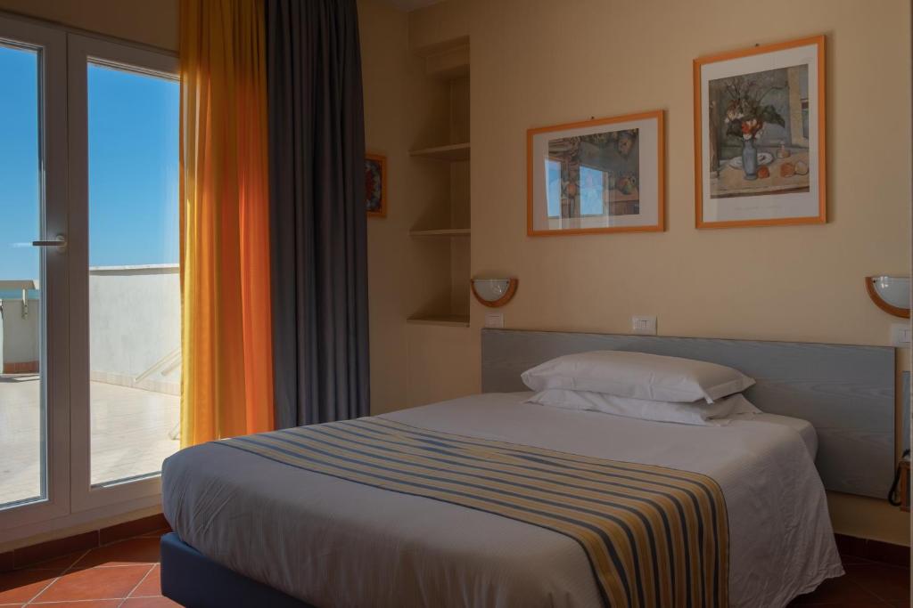 Postel nebo postele na pokoji v ubytování Hotel Ping Pong
