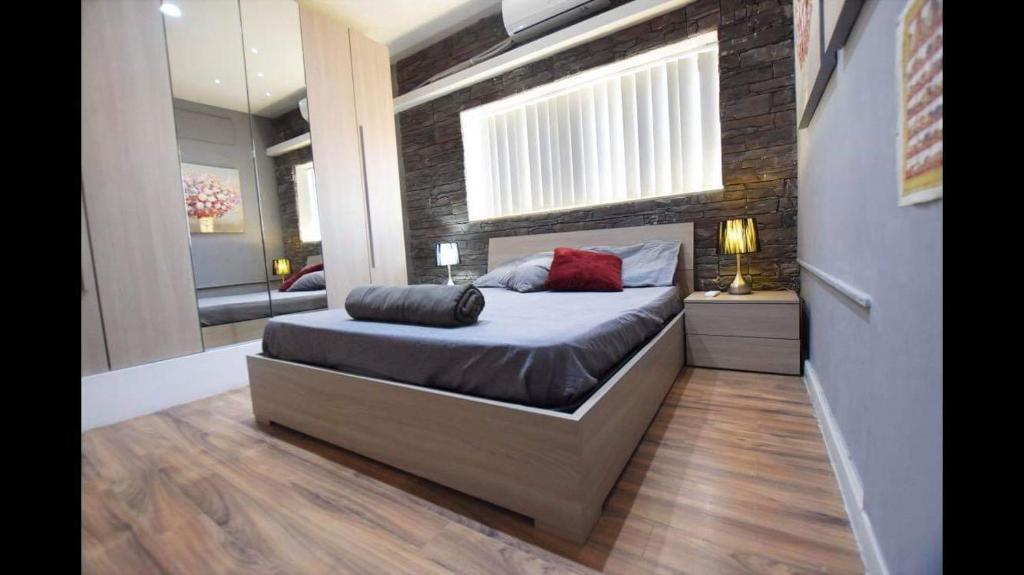 Postel nebo postele na pokoji v ubytování Riviera Penthouse