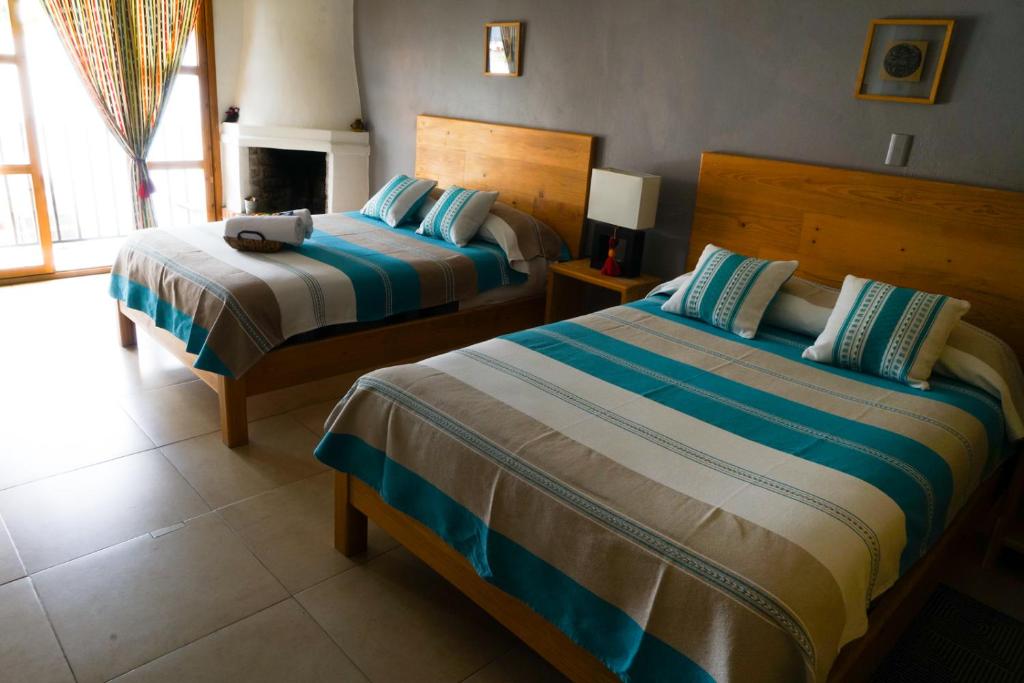 Postel nebo postele na pokoji v ubytování Gaia Guest House
