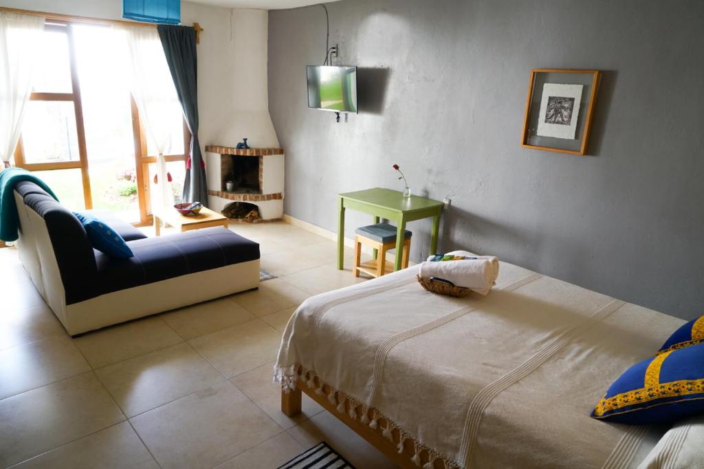 Postel nebo postele na pokoji v ubytování Gaia Guest House