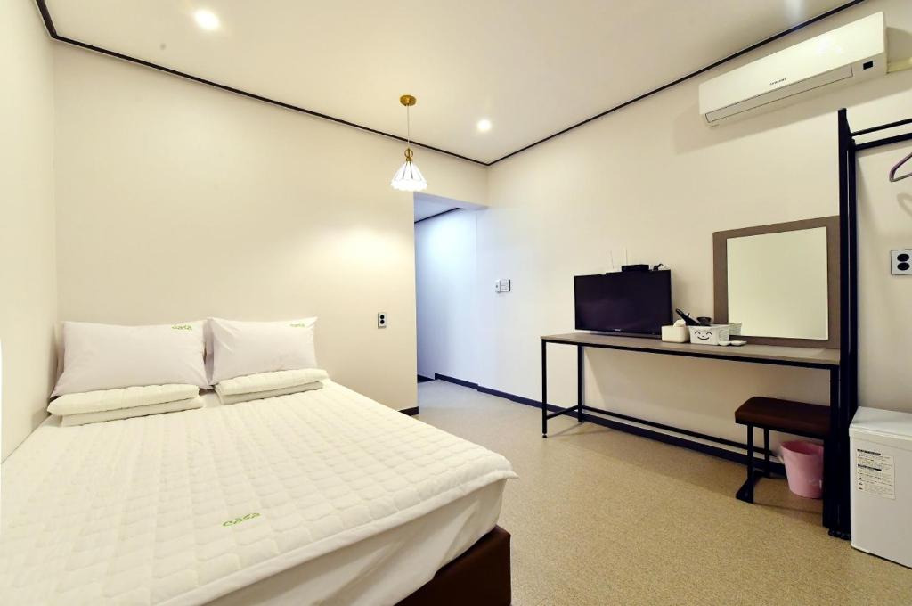 Postel nebo postele na pokoji v ubytování Casa Mini Hotel