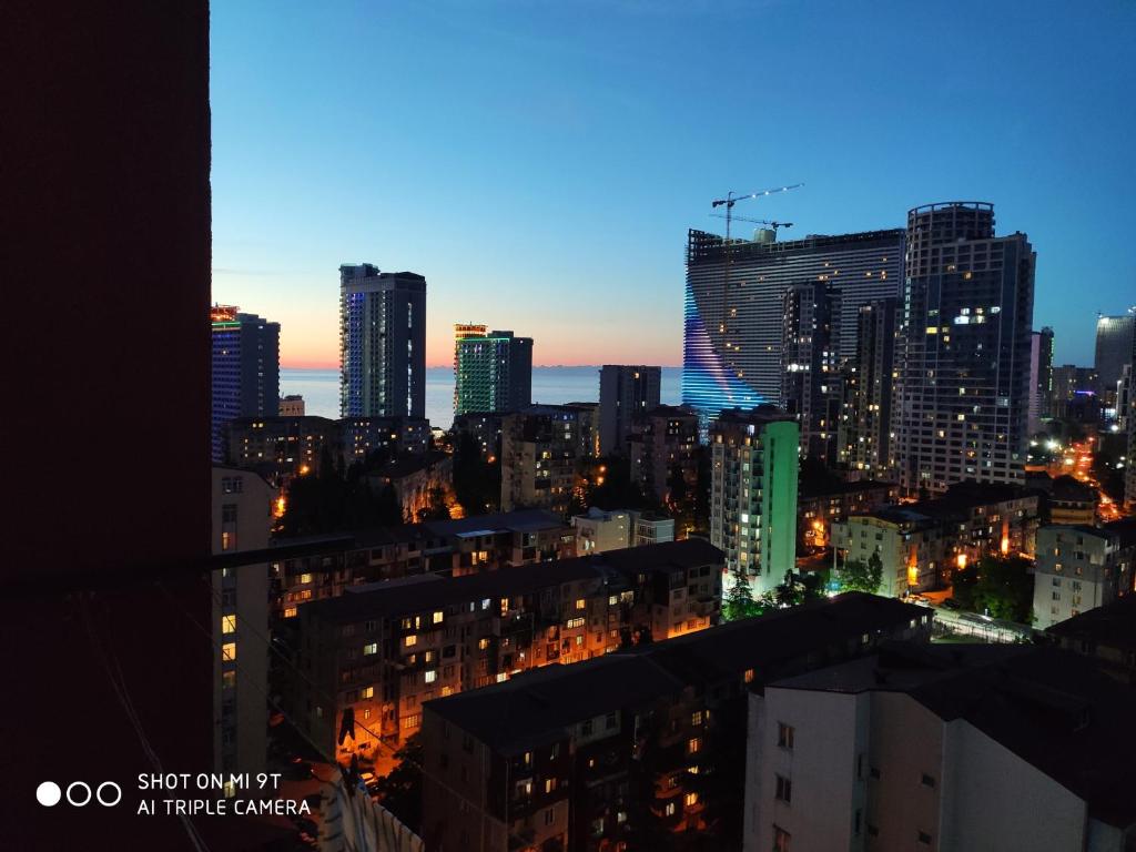 a view of a city at night at Luxury 2 Bedrooms Apartment with 2 bathrooms & Batumi center in Batumi